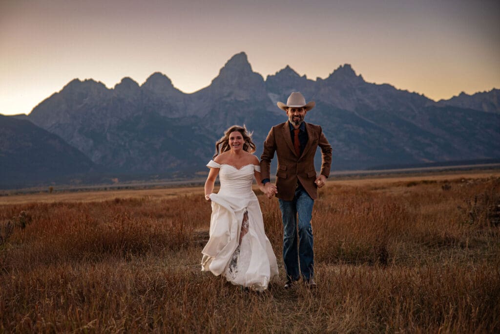 Elopement couples runs through mormon row field