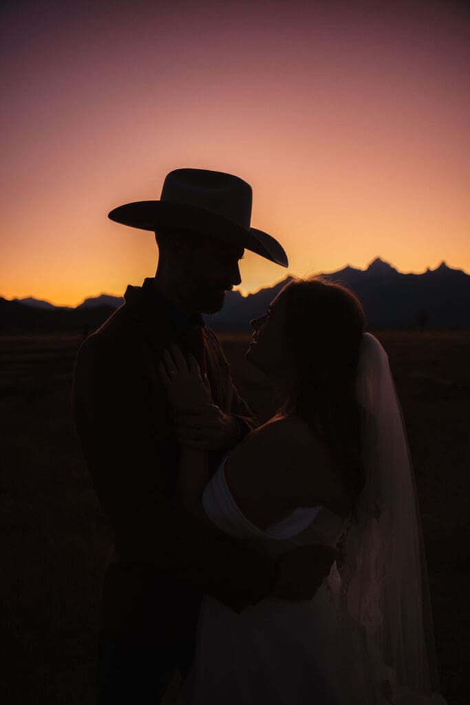 Bride and Groom sunset over the mountains