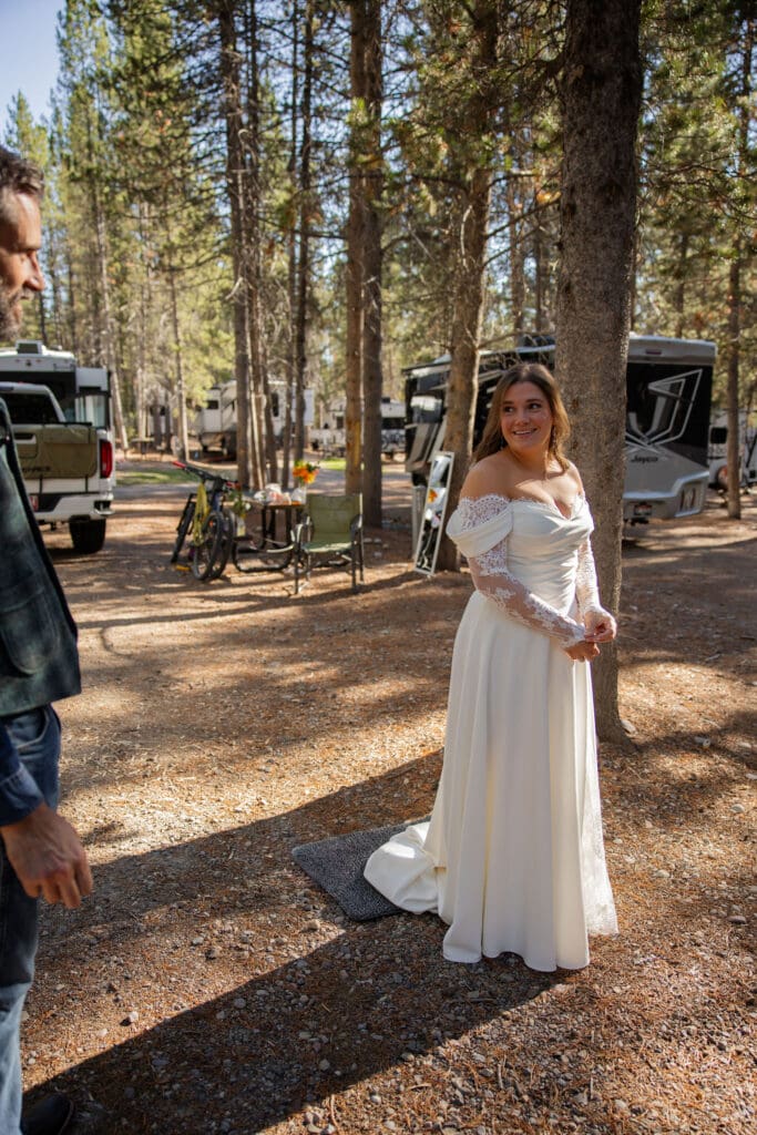 Groom admire bride in her dress for the first time as they prepare for their elopement