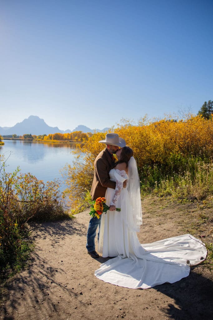 Couple share their first kiss after private vows at oxbow bend