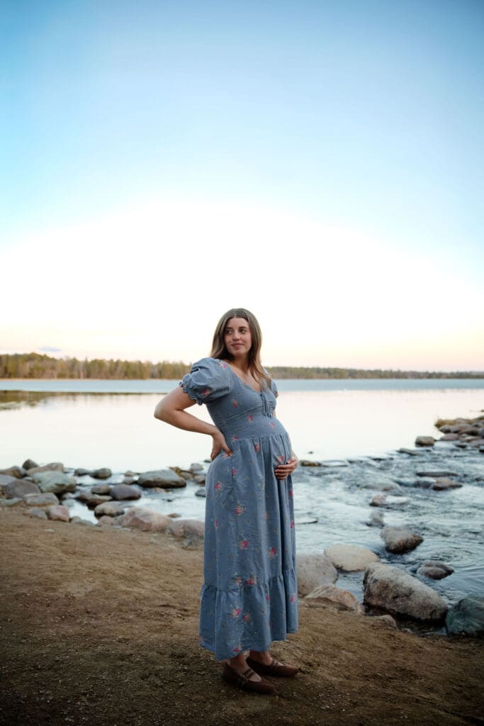 maternity photo in front of lake itasca