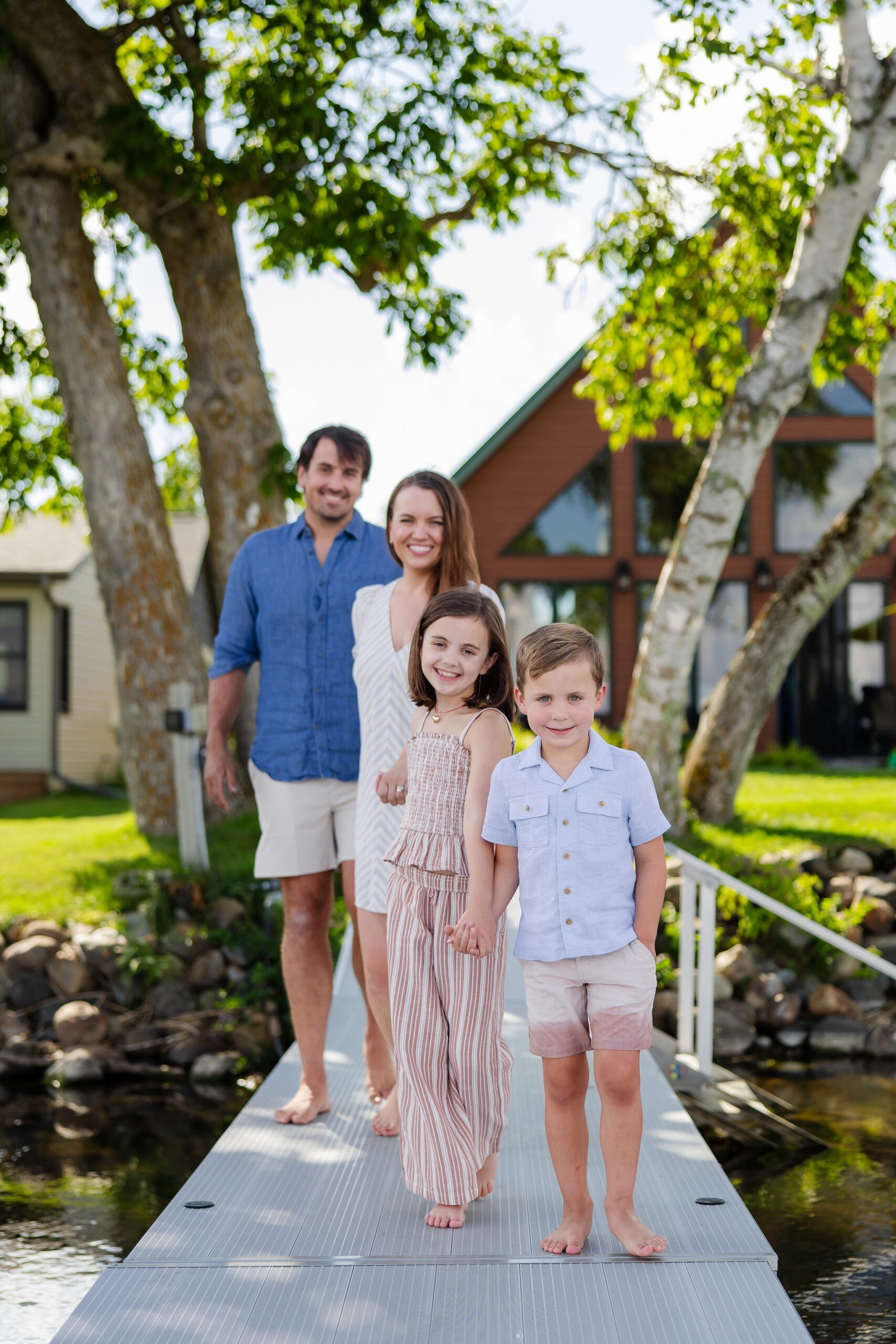 Family walks alongside Lake Bemidji