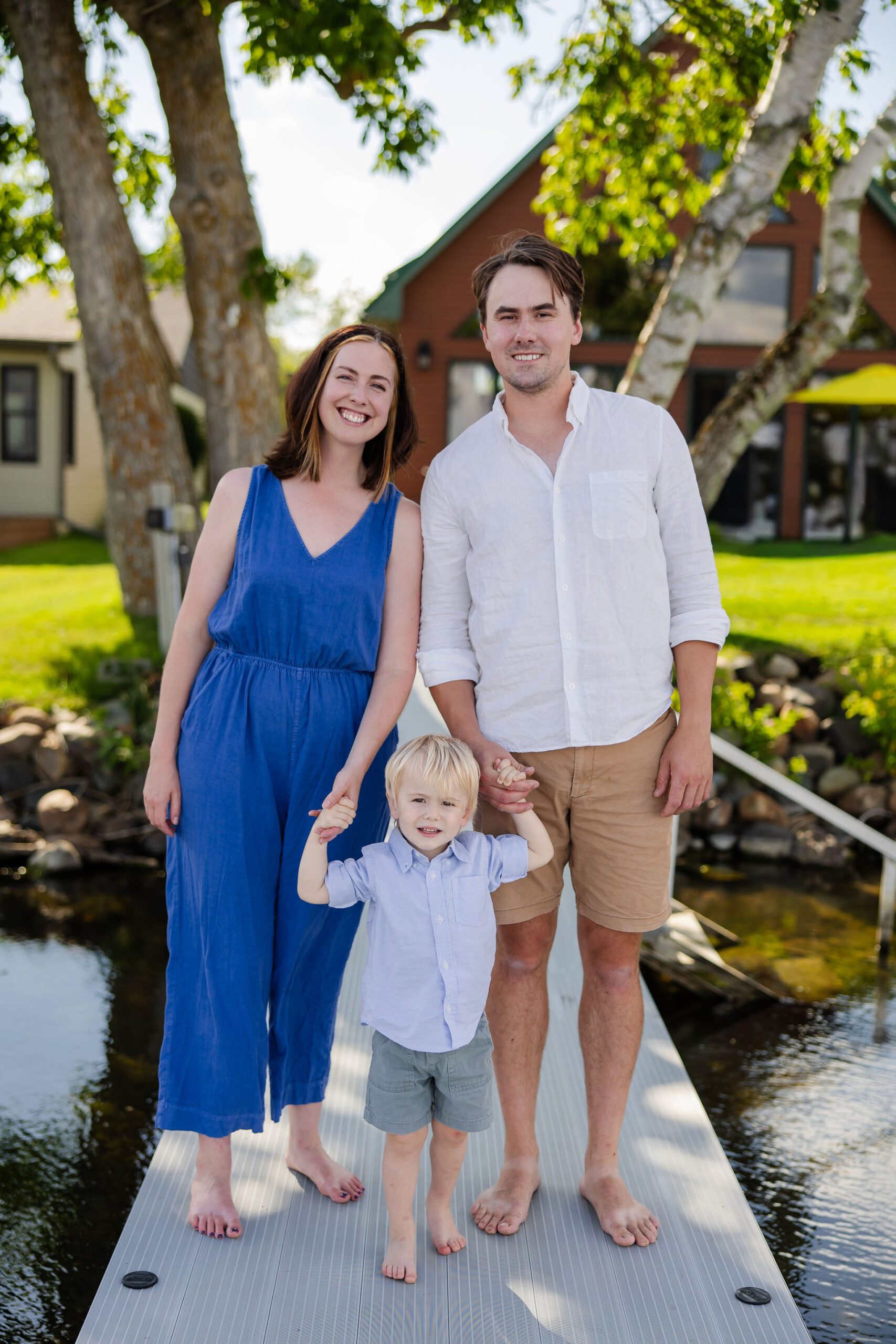 Family walks along dock for photos