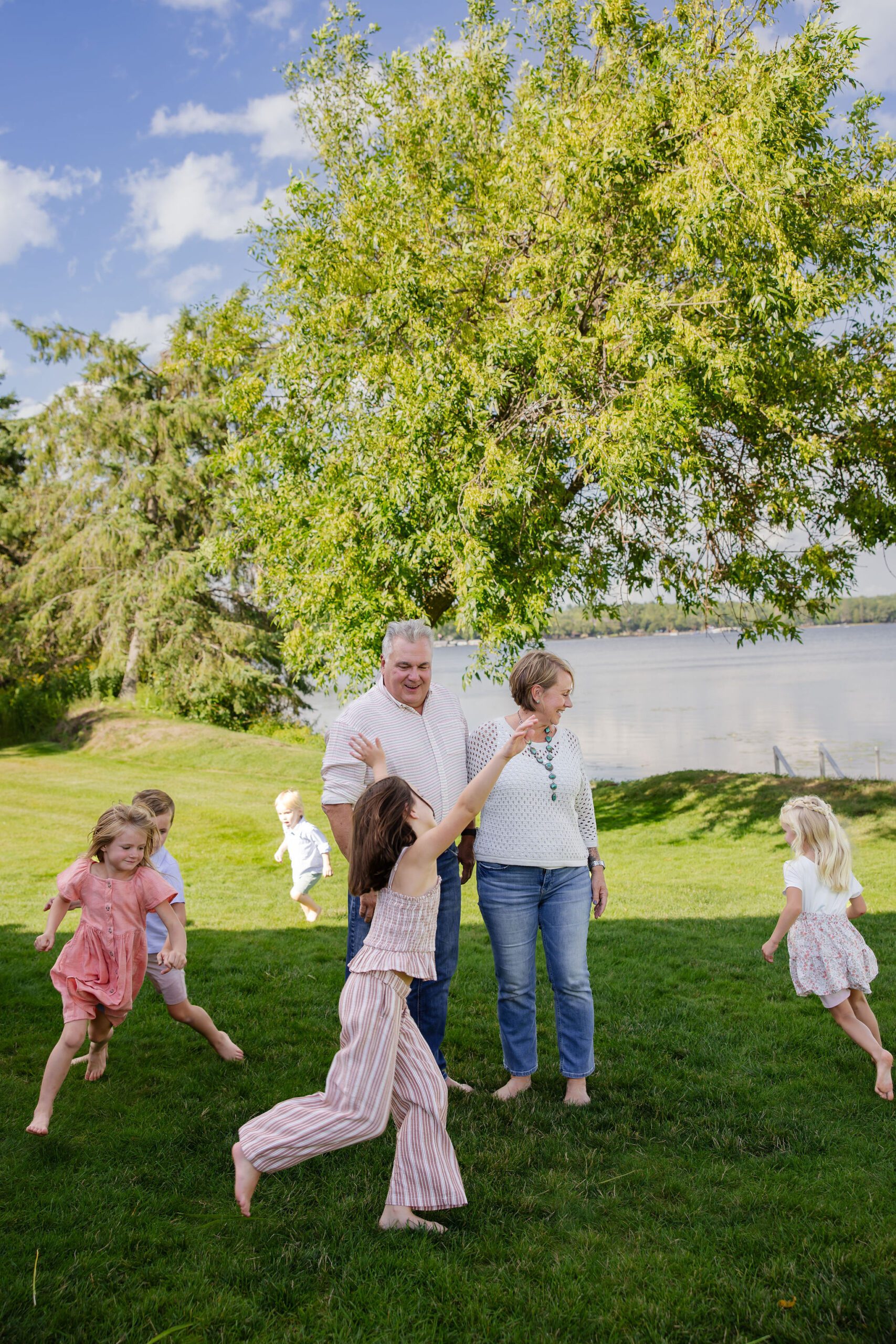 Grandkids run around grandparents 