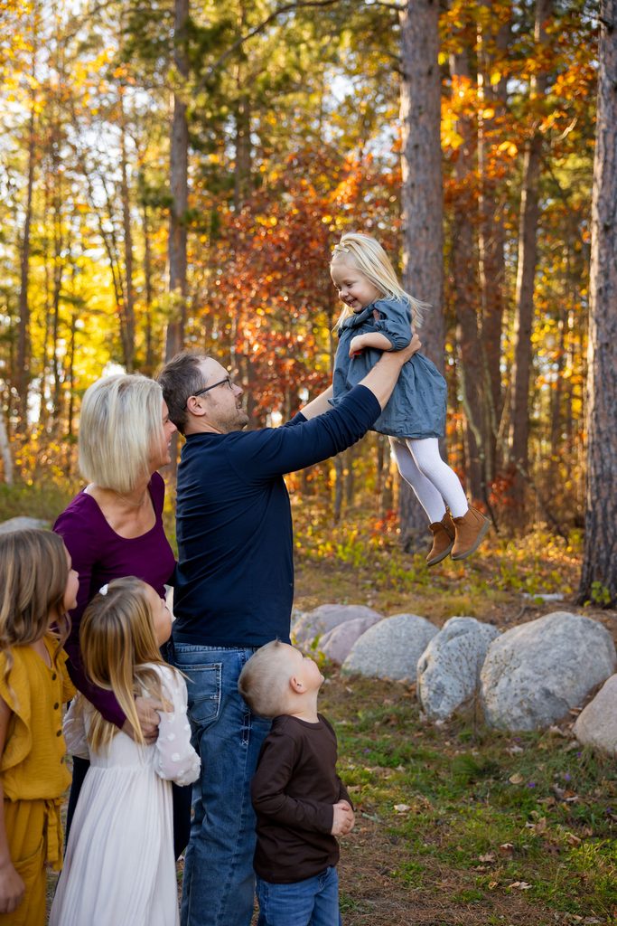 dad plays with baby at photo session