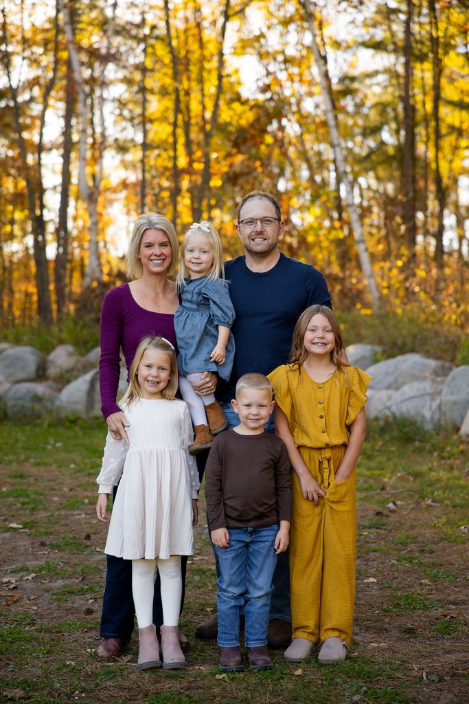 Family smiles during fall family photo session