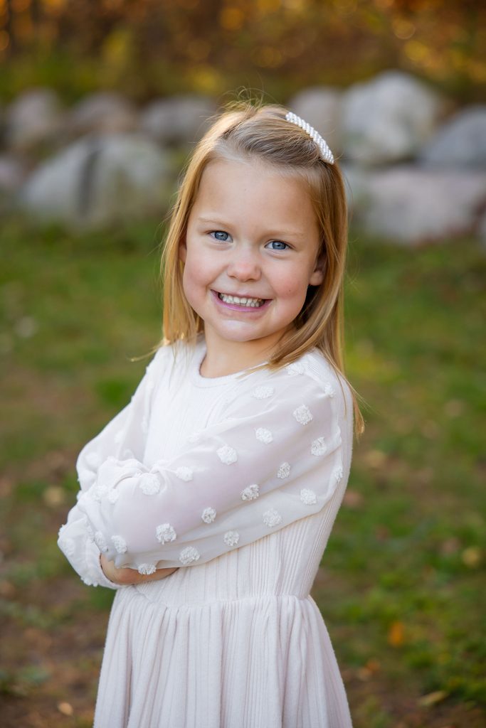 Girl shows big smiles for photos