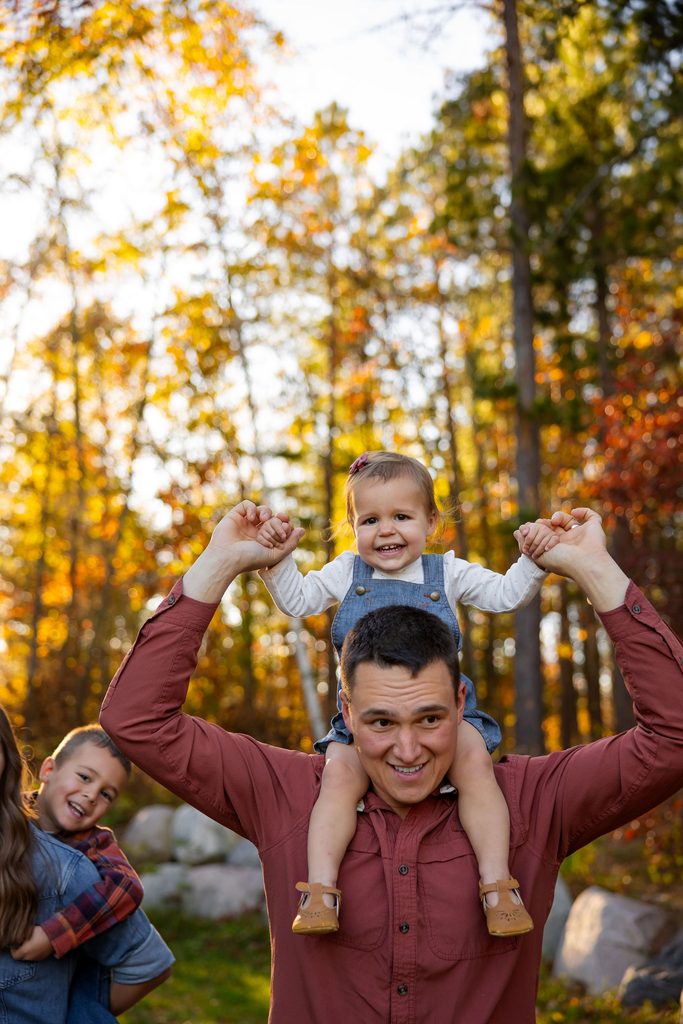 Dad gives baby shoulder ride