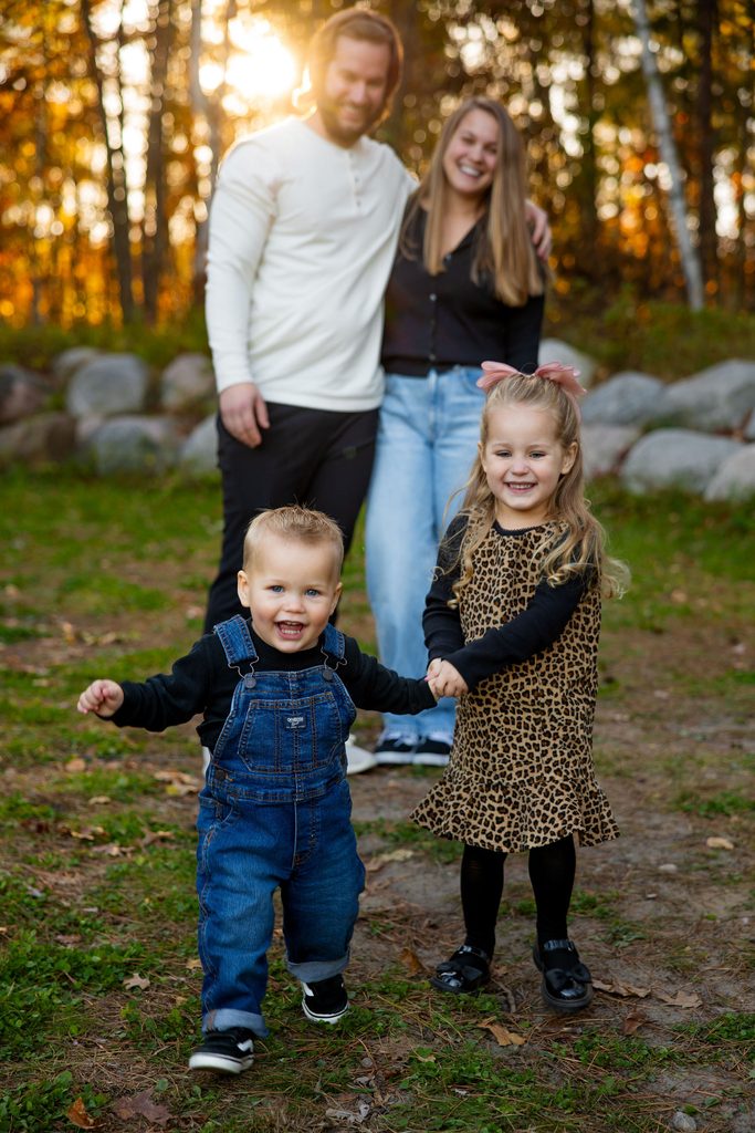girl runs to catch up to brother at the photo session