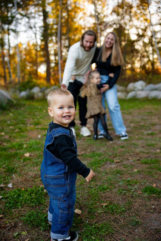 Little boy smiles at camera