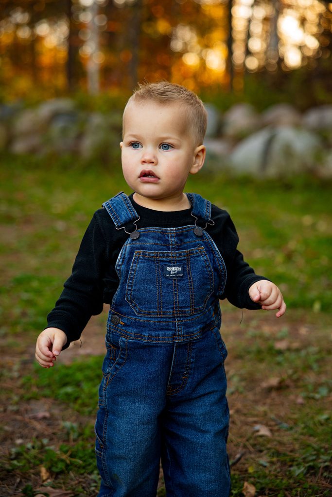 Little boy look stoic for family photos