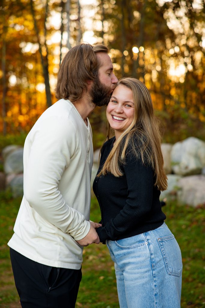 Dad kisses mom for photos