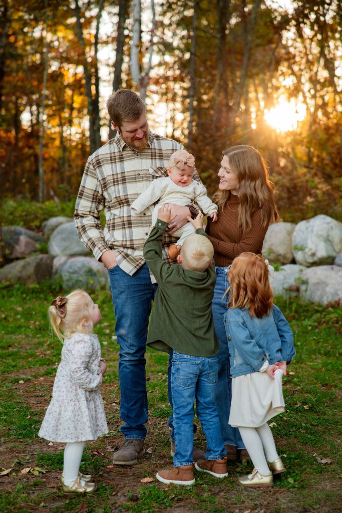 siblings tickle youngest sibling
