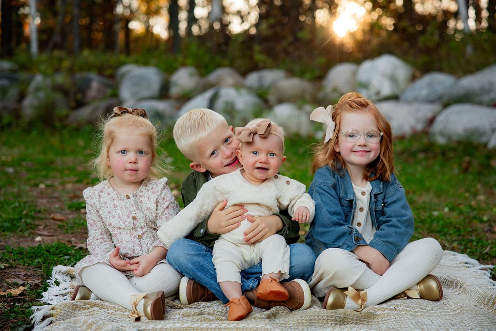 Siblings share a hug during family photo session