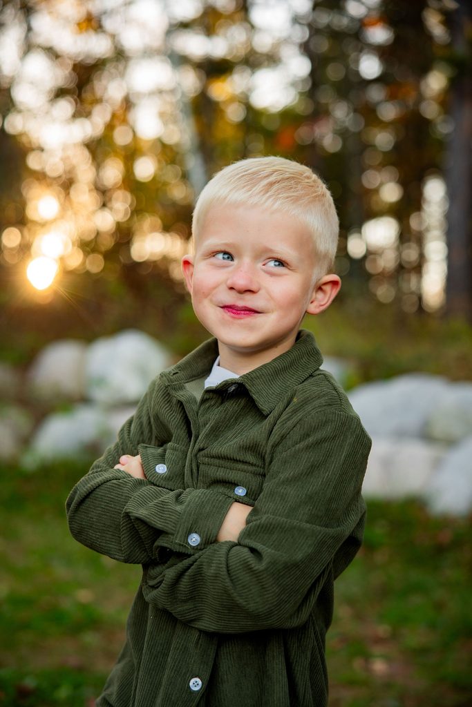 Little boy smirks during family photo session