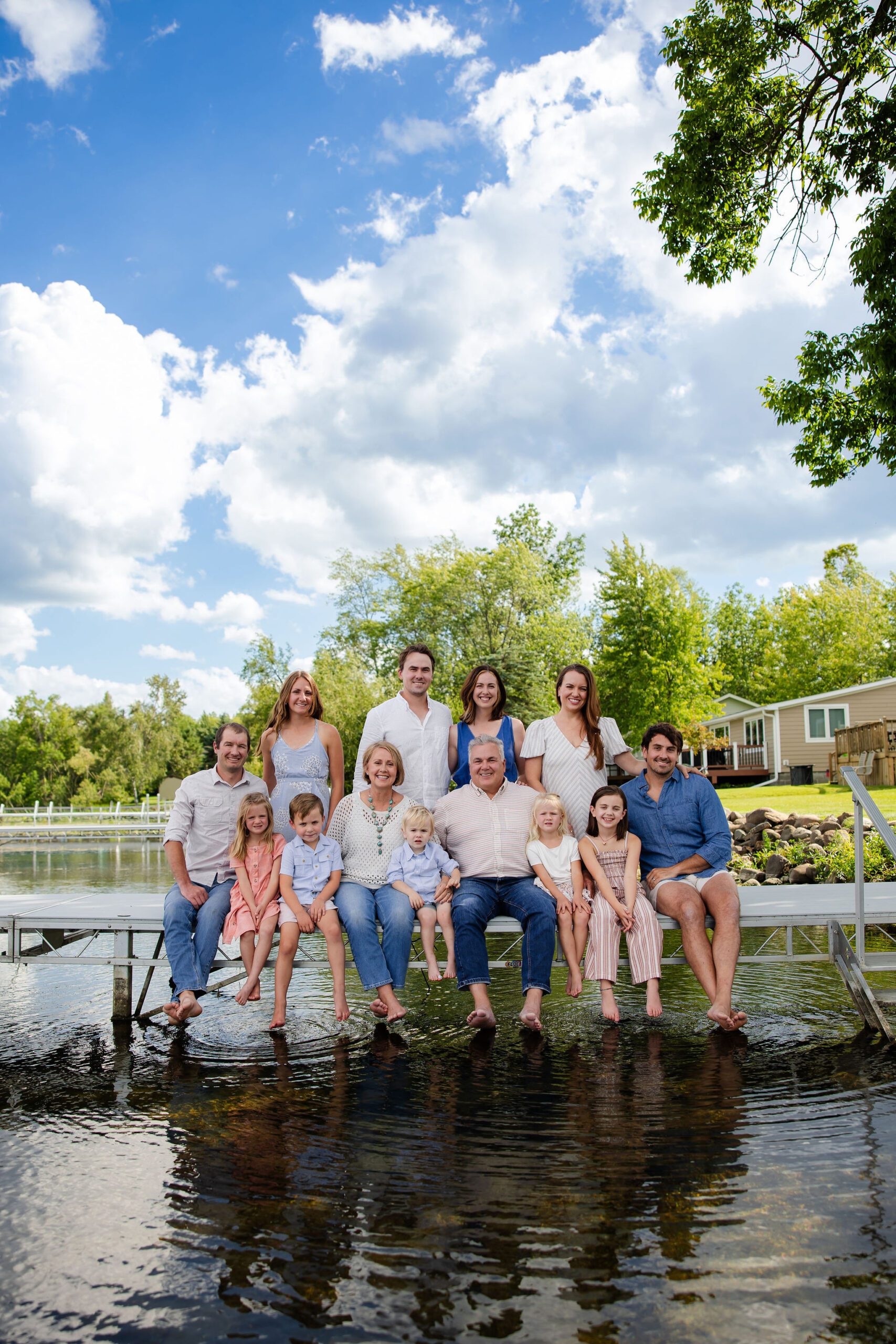 Extended family sits on dock for photo